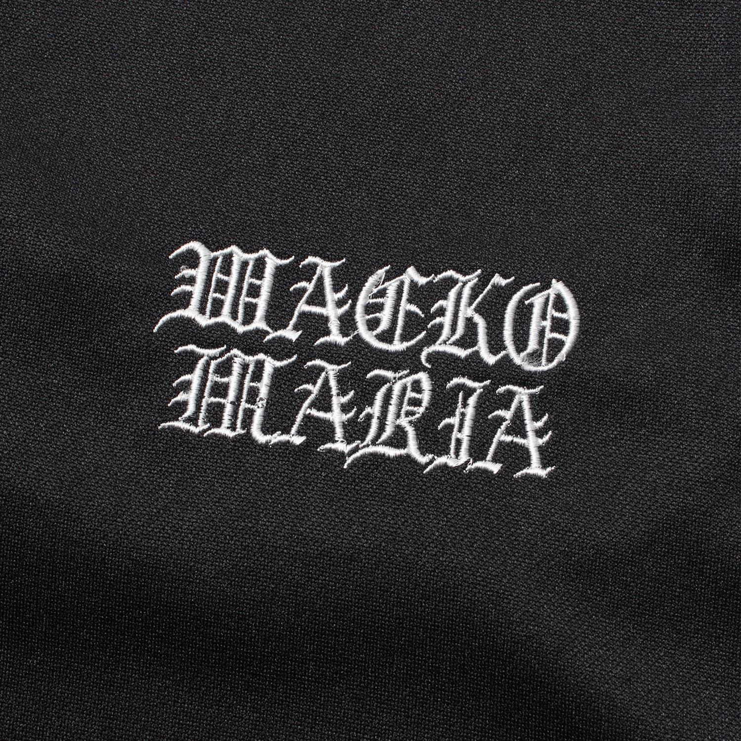 WACKO MARIA（ワコマリア）2026年春夏コレクション「天国東京」から、フットボールブランド「UMBLO（アンブロ）」とのオフィシャルコラボレーショントラックパンツUMBRO / JERSEY TRACK PANTS (TYPE-1) 26SS-WMO-UB04のブラック。アップ2